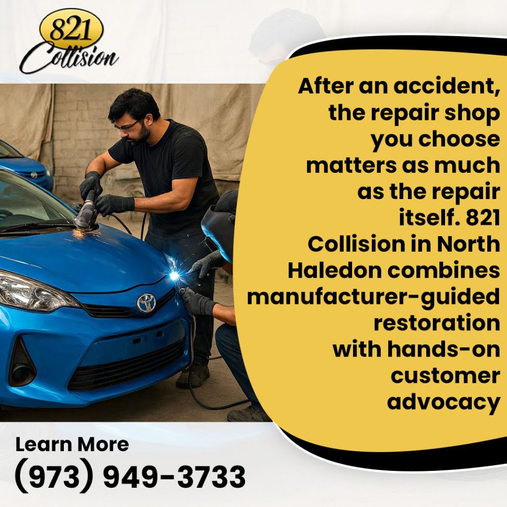 Auto body technicians repairing front-end collision damage on a blue vehicle